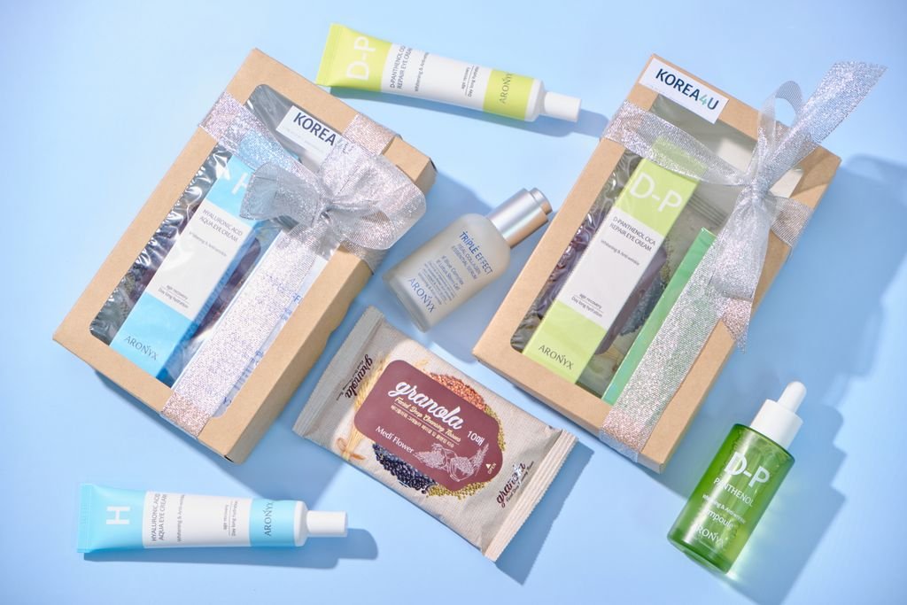 Beautifully arranged skincare gift sets with elegant ribbon packaging, perfect for a special occasion.