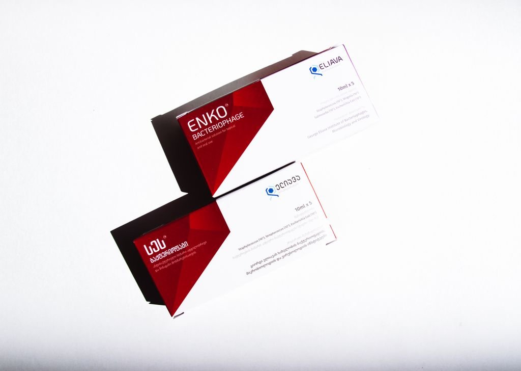 Boxes of bacteriophage medication with red and white design on a white background.