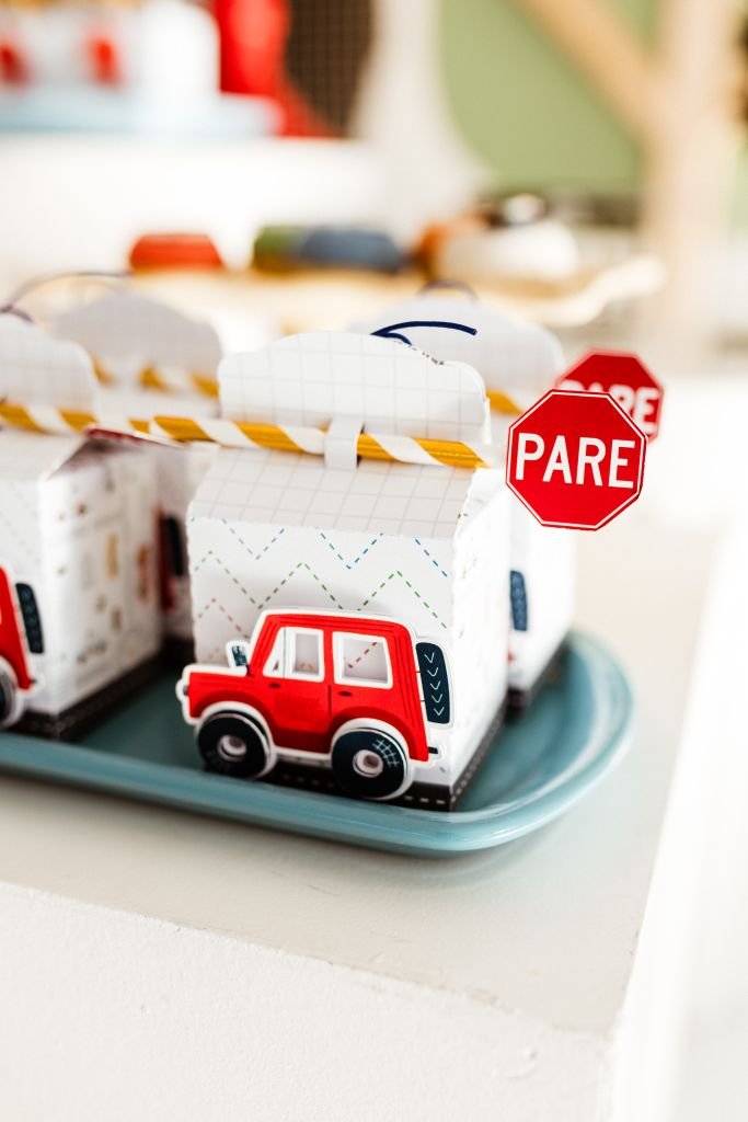 Bright toy car-themed decorations with red stop sign detail, perfect for children's parties.